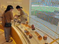 Visitors are shopping at Louis Vuitton's first chocolate store in Shanghai, China, on July 23, 2024. (