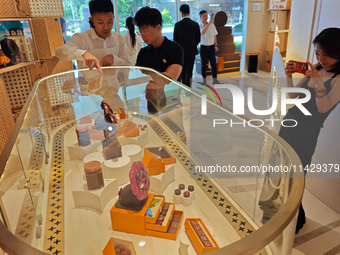 Visitors are shopping at Louis Vuitton's first chocolate store in Shanghai, China, on July 23, 2024. (