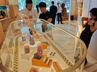 Visitors are shopping at Louis Vuitton's first chocolate store in Shanghai, China, on July 23, 2024. (