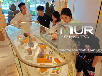 Visitors are shopping at Louis Vuitton's first chocolate store in Shanghai, China, on July 23, 2024. (