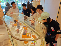 Visitors are shopping at Louis Vuitton's first chocolate store in Shanghai, China, on July 23, 2024. (