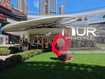 Tourists are lining up at Louis Vuitton's first chocolate store in Shanghai, China, on July 23, 2024. (