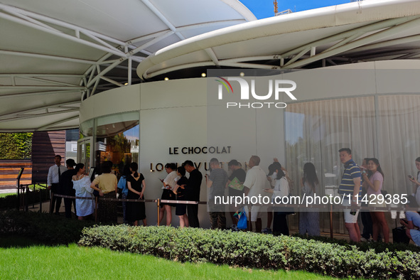 Tourists are lining up at Louis Vuitton's first chocolate store in Shanghai, China, on July 23, 2024. 