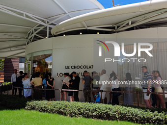 Tourists are lining up at Louis Vuitton's first chocolate store in Shanghai, China, on July 23, 2024. (