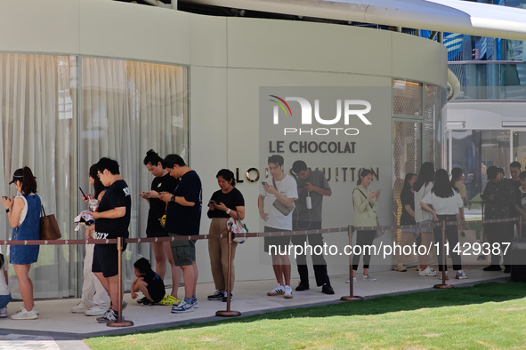 Tourists are lining up at Louis Vuitton's first chocolate store in Shanghai, China, on July 23, 2024. 