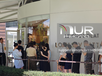 Tourists are lining up at Louis Vuitton's first chocolate store in Shanghai, China, on July 23, 2024. (