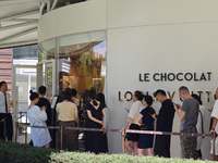 Tourists are lining up at Louis Vuitton's first chocolate store in Shanghai, China, on July 23, 2024. (