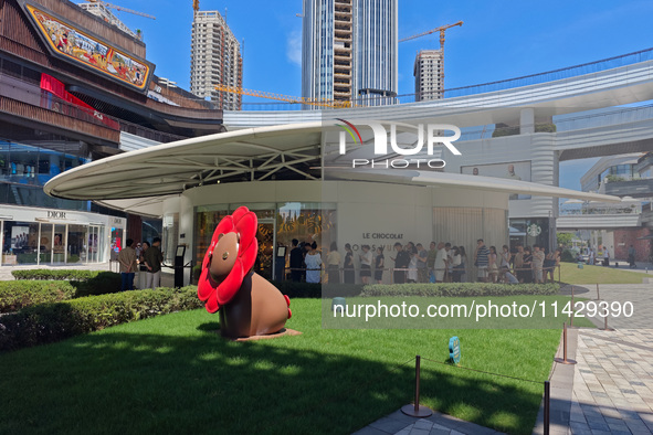 Tourists are lining up at Louis Vuitton's first chocolate store in Shanghai, China, on July 23, 2024. 