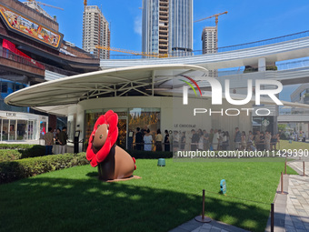 Tourists are lining up at Louis Vuitton's first chocolate store in Shanghai, China, on July 23, 2024. (