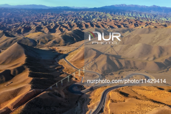 Workers are installing and inspecting a coal transport corridor on Road 147 in Hutubi County, Changji Hui Autonomous Prefecture, Xinjiang, C...