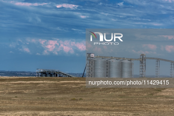 Workers are installing and inspecting a coal transport corridor on Road 147 in Hutubi County, Changji Hui Autonomous Prefecture, Xinjiang, C...