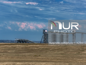 Workers are installing and inspecting a coal transport corridor on Road 147 in Hutubi County, Changji Hui Autonomous Prefecture, Xinjiang, C...