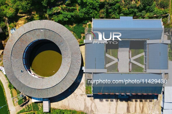 A square building and a round building are being seen in Maojianshan township, Yuexi County, in Anqing, China, on July 22, 2024. 