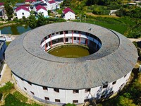 A square building and a round building are being seen in Maojianshan township, Yuexi County, in Anqing, China, on July 22, 2024. (