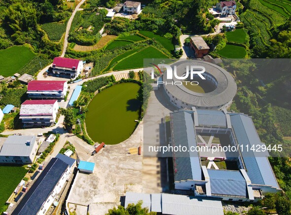 A square building and a round building are being seen in Maojianshan township, Yuexi County, in Anqing, China, on July 22, 2024. 