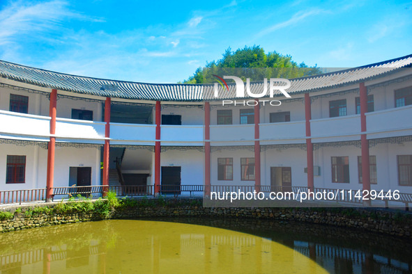 A square building and a round building are being seen in Maojianshan township, Yuexi County, in Anqing, China, on July 22, 2024. 