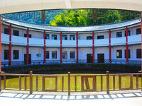 A square building and a round building are being seen in Maojianshan township, Yuexi County, in Anqing, China, on July 22, 2024. (