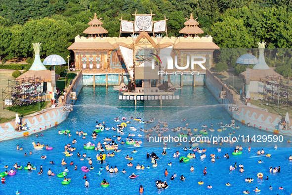 Citizens are cooling off at a water park in Nanjing, China, on July 23, 2024. 