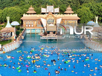 Citizens are cooling off at a water park in Nanjing, China, on July 23, 2024. (