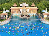 Citizens are cooling off at a water park in Nanjing, China, on July 23, 2024. (