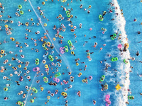 Citizens are cooling off at a water park in Nanjing, China, on July 23, 2024. (