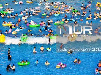 Citizens are cooling off at a water park in Nanjing, China, on July 23, 2024. (