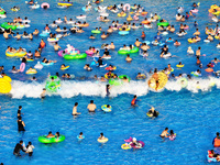 Citizens are cooling off at a water park in Nanjing, China, on July 23, 2024. (