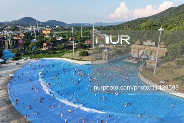 Citizens are cooling off at a water park in Nanjing, China, on July 23, 2024. 