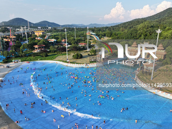 Citizens are cooling off at a water park in Nanjing, China, on July 23, 2024. (