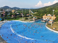 Citizens are cooling off at a water park in Nanjing, China, on July 23, 2024. (