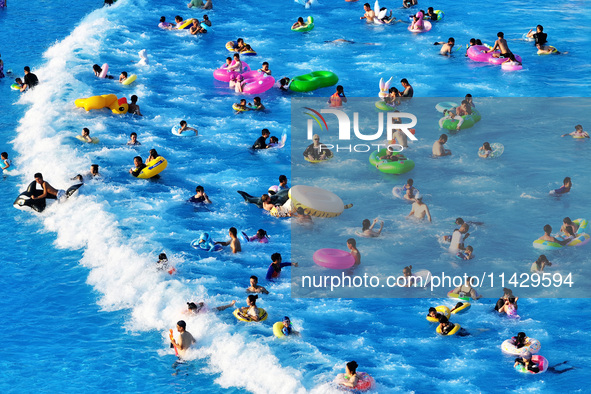 Citizens are cooling off at a water park in Nanjing, China, on July 23, 2024. 