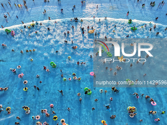 Citizens are cooling off at a water park in Nanjing, China, on July 23, 2024. (