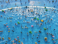 Citizens are cooling off at a water park in Nanjing, China, on July 23, 2024. (