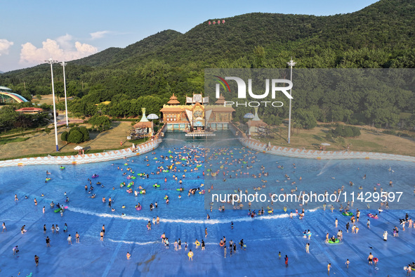 Citizens are cooling off at a water park in Nanjing, China, on July 23, 2024. 