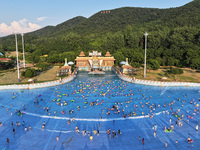 Citizens are cooling off at a water park in Nanjing, China, on July 23, 2024. (