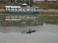 A man is fishing on the waters of river Jhelum as the dry spell is continuing in Srinagar, Jammu and Kashmir, on July 23, 2024. A prolonged...