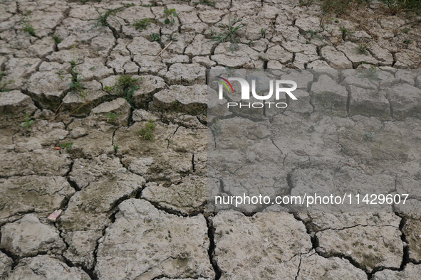 A dried portion of the river Jhelum is visible from above as the dry spell is continuing in Srinagar, Jammu and Kashmir, on July 23, 2024. A...