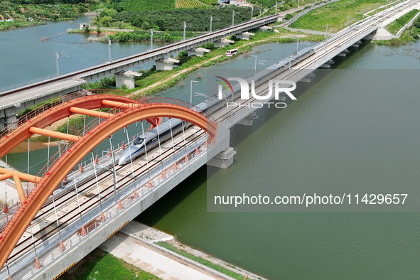 A high-speed comprehensive inspection train is running on the Penglai section of Weifang High-speed Railway in Yantai, China, on July 23, 20...