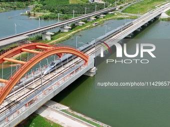 A high-speed comprehensive inspection train is running on the Penglai section of Weifang High-speed Railway in Yantai, China, on July 23, 20...