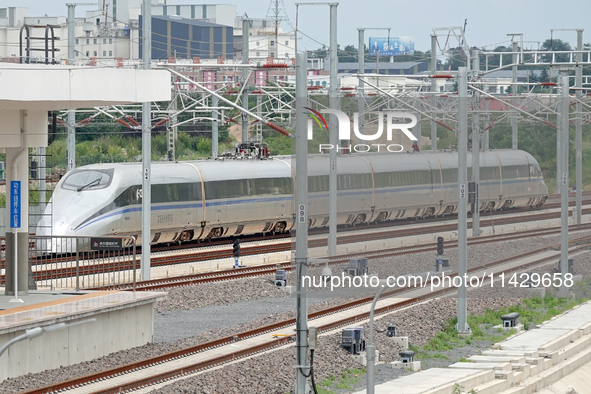 A high-speed comprehensive inspection train is running on the Penglai section of Weifang High-speed Railway in Yantai, China, on July 23, 20...