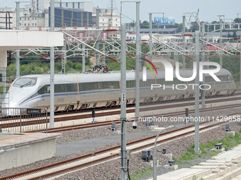 A high-speed comprehensive inspection train is running on the Penglai section of Weifang High-speed Railway in Yantai, China, on July 23, 20...