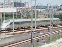 A high-speed comprehensive inspection train is running on the Penglai section of Weifang High-speed Railway in Yantai, China, on July 23, 20...