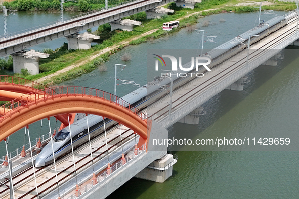 A high-speed comprehensive inspection train is running on the Penglai section of Weifang High-speed Railway in Yantai, China, on July 23, 20...