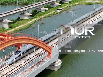 A high-speed comprehensive inspection train is running on the Penglai section of Weifang High-speed Railway in Yantai, China, on July 23, 20...