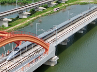 A high-speed comprehensive inspection train is running on the Penglai section of Weifang High-speed Railway in Yantai, China, on July 23, 20...