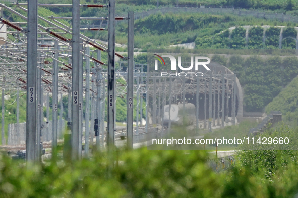 A high-speed comprehensive inspection train is running on the Penglai section of Weifang High-speed Railway in Yantai, China, on July 23, 20...