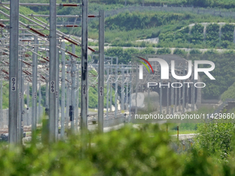 A high-speed comprehensive inspection train is running on the Penglai section of Weifang High-speed Railway in Yantai, China, on July 23, 20...