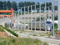 A high-speed comprehensive inspection train is running on the Penglai section of Weifang High-speed Railway in Yantai, China, on July 23, 20...