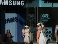 People are standing in front of a Samsung storefront on Nanjing Road in Shanghai, China, on July 23, 2024. (