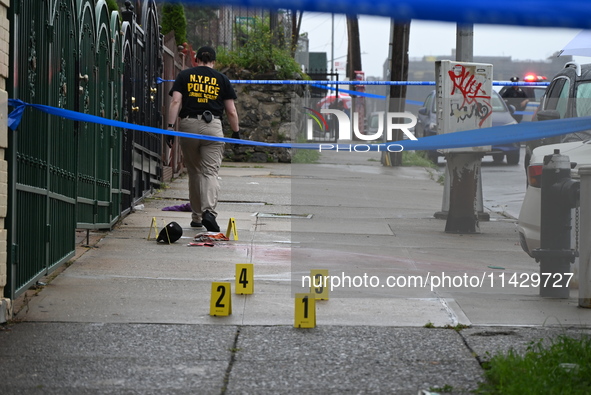 Evidence markers are being placed at the scene of the fatal shooting of a 28-year-old male in the Bronx, New York. A 28-year-old male victim...